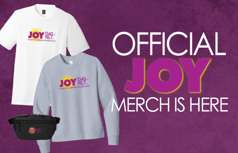 Banner advertising official JOY merch with white and light-blue shirts and a black fanny pack on a purple background, including the Joy logo and sun emblem.